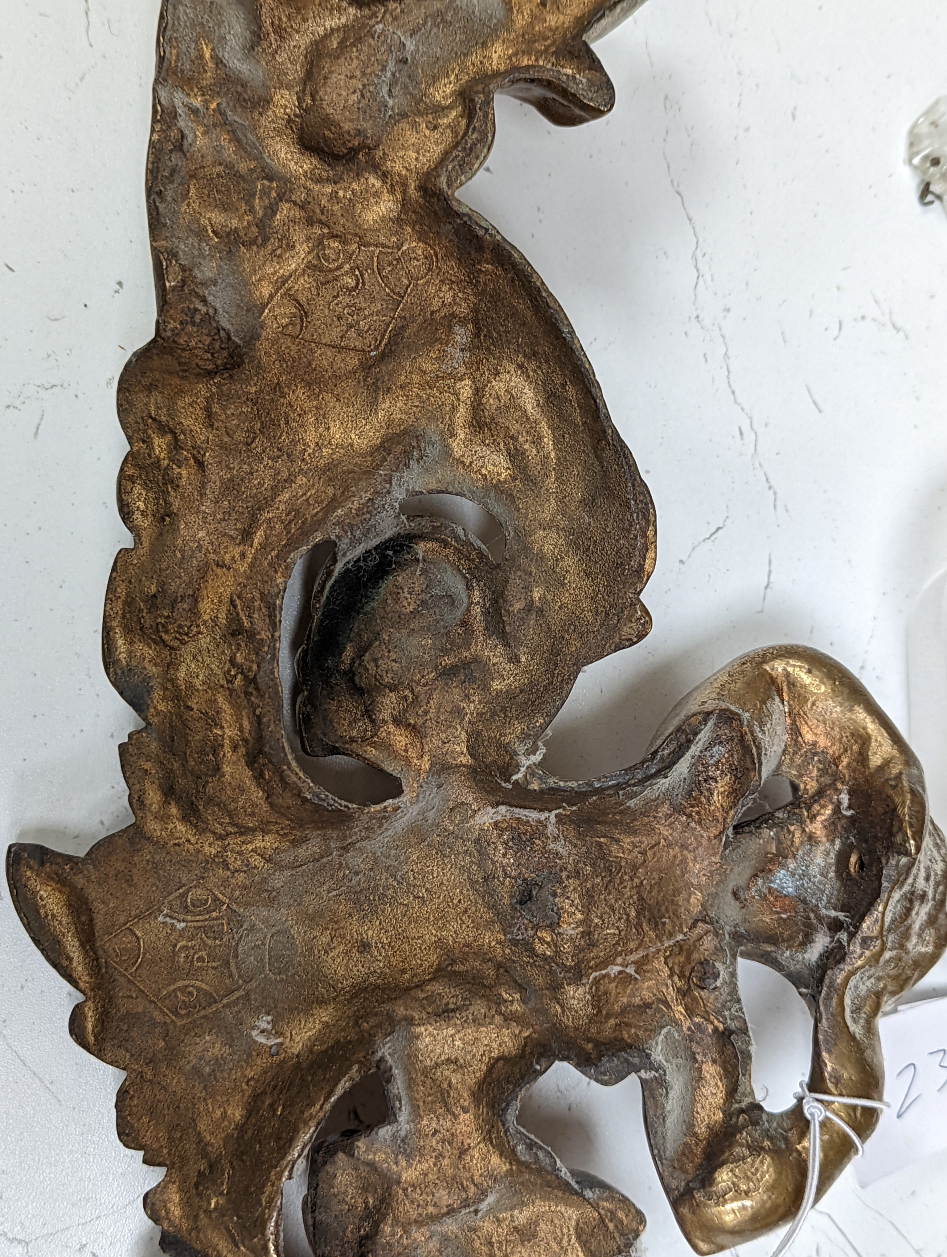 A pair of ormolu and cut glass twin branch wall lights, a bag light and a brass mount